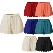 Fashion Solid Color Elastic Waist Lace Spliced Hem Shorts
